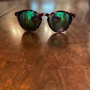 Sunski green tint mirrored polarized sunglasses.